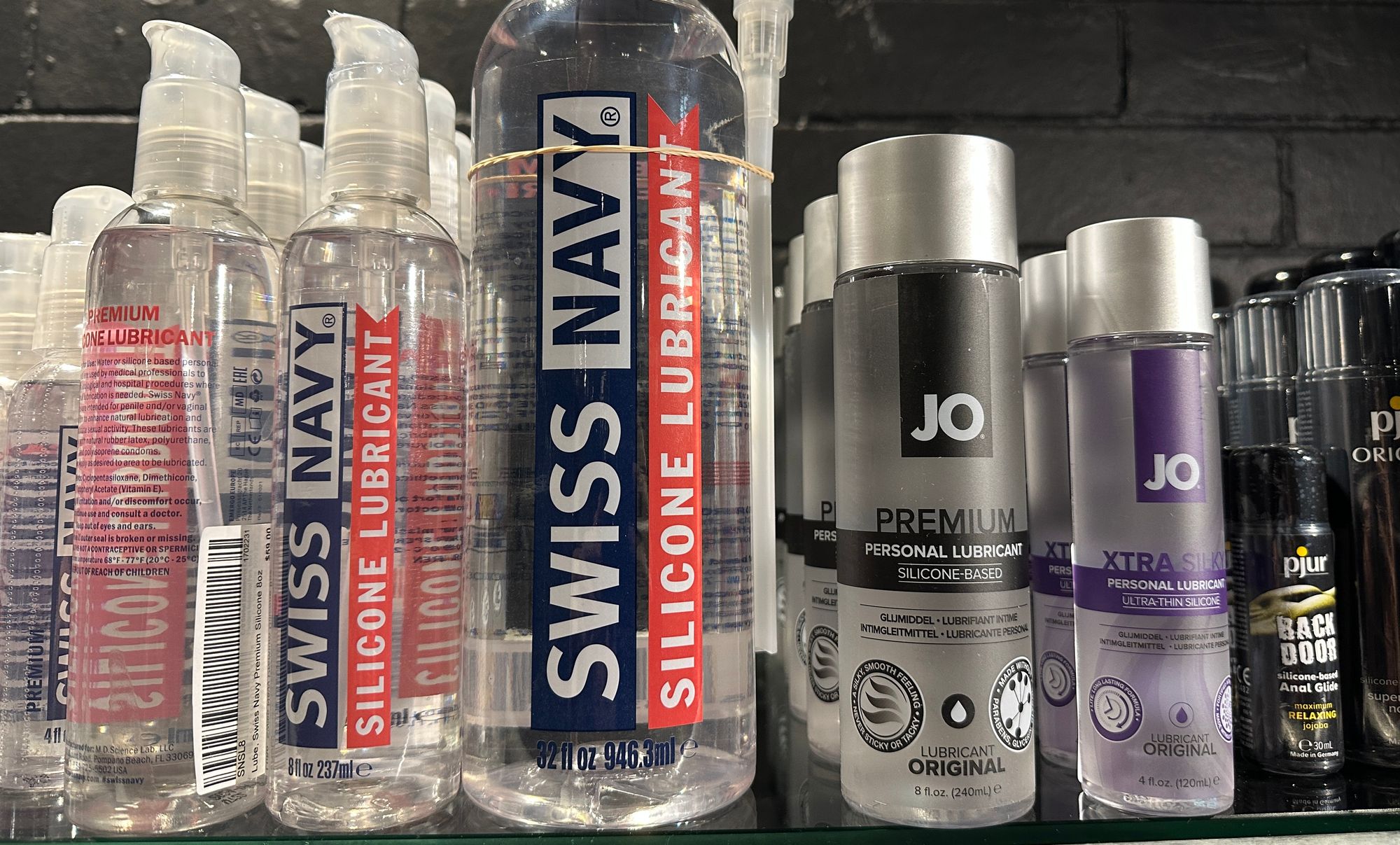 multiple bottles of personal lubricant suitable for anal sex